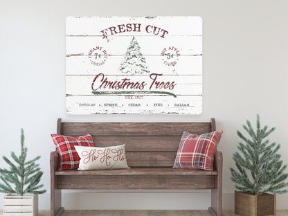 a wooden bench with christmas trees on it